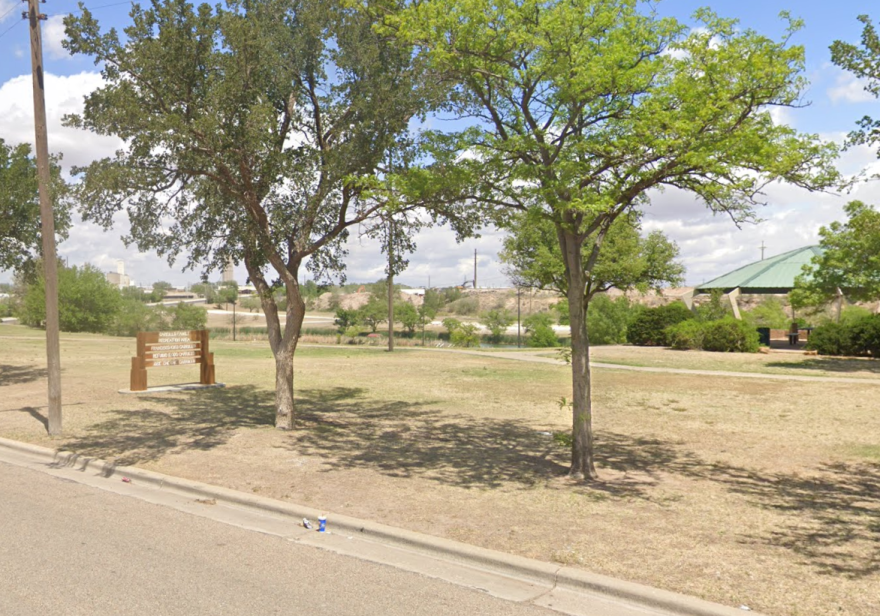 Carillo Family rest area at the Canyon Rim by Cesar E. Chavez Drive, with PB Materials concrete mixing plant north across Comancheria Lake.