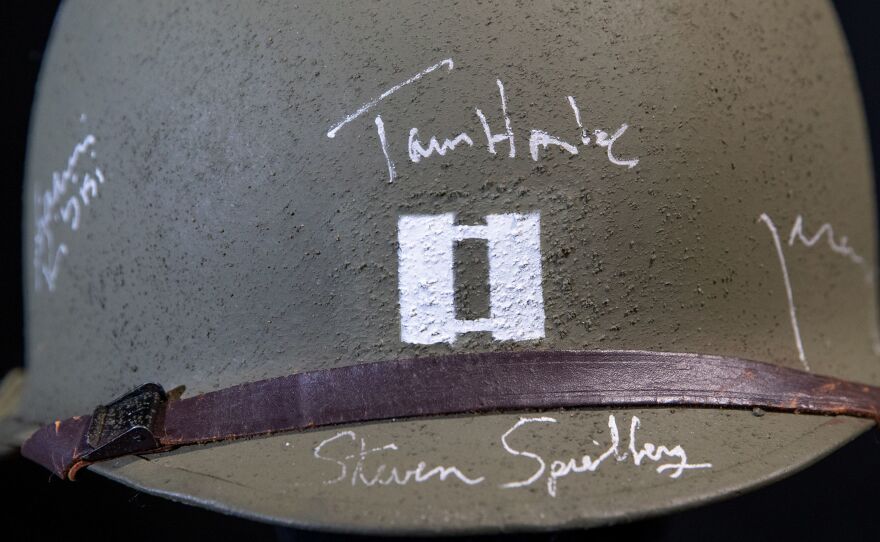 A cast-autographed helmet belonging to the character Hanks played in the 1998 World War II drama <em>Saving Private Ryan.</em>
