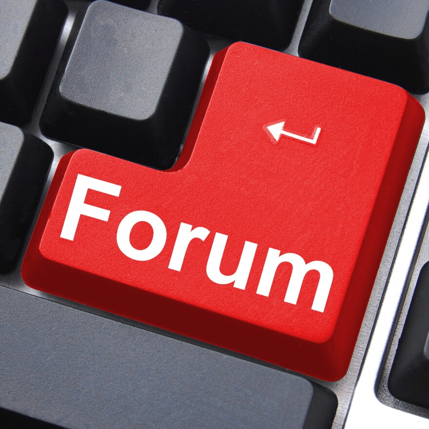 internet forum concept with key on computer keyboard