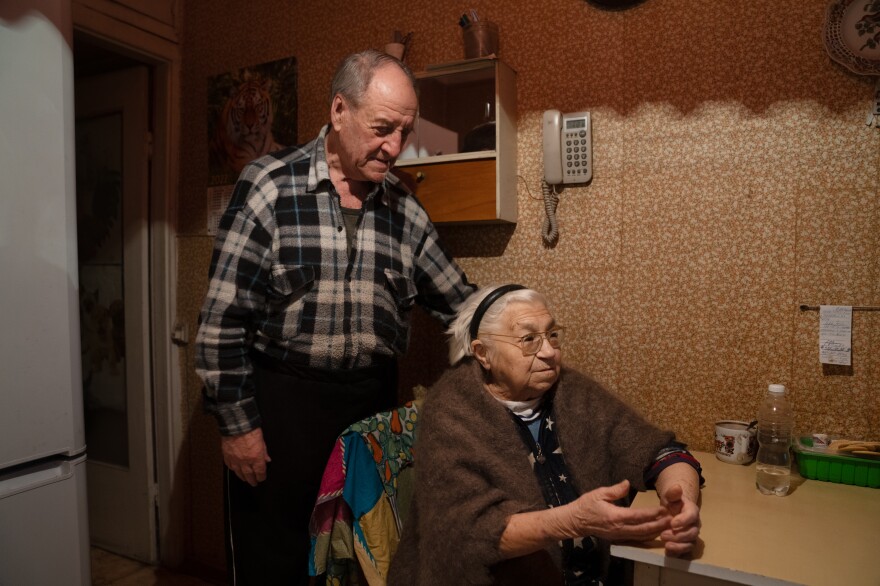 Pavlo Komodovskyi and his wife, Tamara Vasylenko, who had a stroke this year, in their kitchen in their apartment in Kyiv.