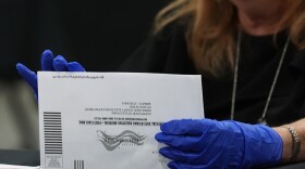 An election worker sorts vote-by-mail ballots at the Miami-Dade County Supervisor of Elections Office for the Florida primary election in Doral, Fla., Tuesday, Aug. 18, 2026.