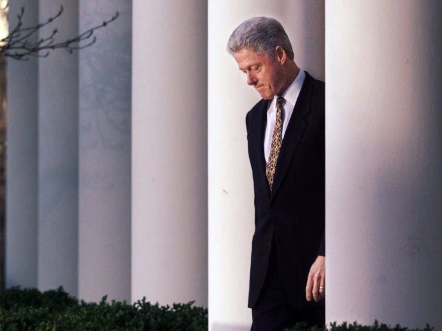 President Clinton walks to the White House Rose Garden to deliver a statement on the impeachment inquiry on Dec. 11, 1998.