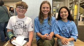 (left to right) Michael Tranberg, Addison Myers and Stella Falsey were among the Sand Lake Elementary School students behind the effort to rename Sand Lake Park to Chitose Park. (Wesley Early/Alaska Public Media)