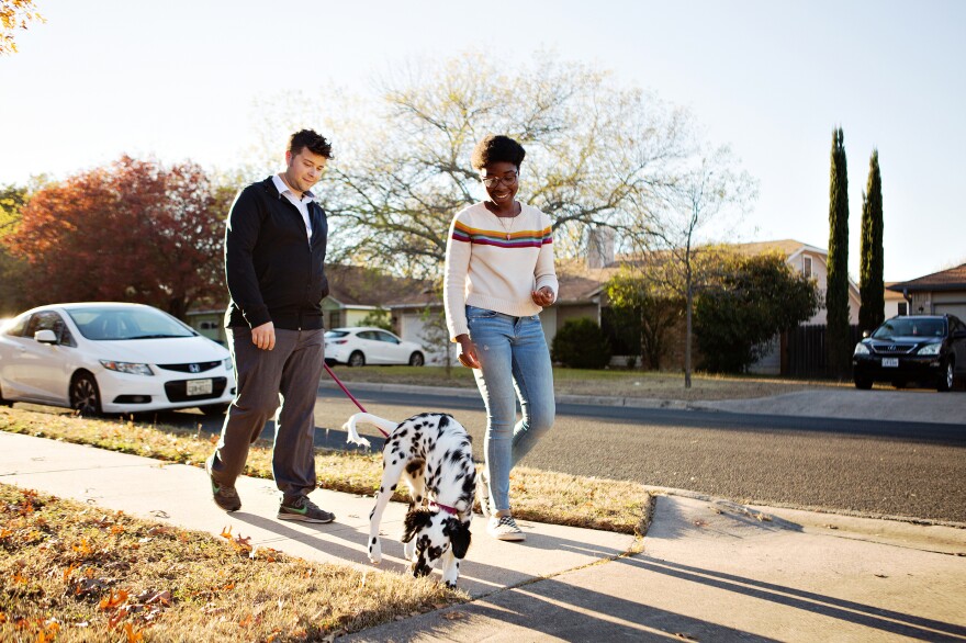 Andrew and Robi walk their puppy, Libby. The pandemic undercut both of their careers. Robi has relied on unemployment benefits since May and Andrew leaned into his work at a restaurant.