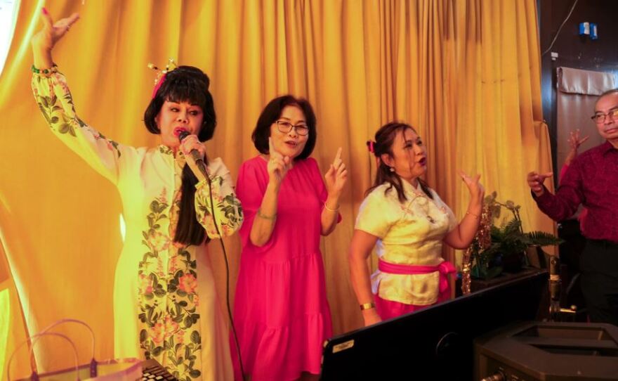 Pashree "SuperPat" Silapee, left, convenes a Thai social group that met occasionally at Star Dance. The theme for their Jan. 2023 meeting at a Burbank restaurant was Lunar New Year.