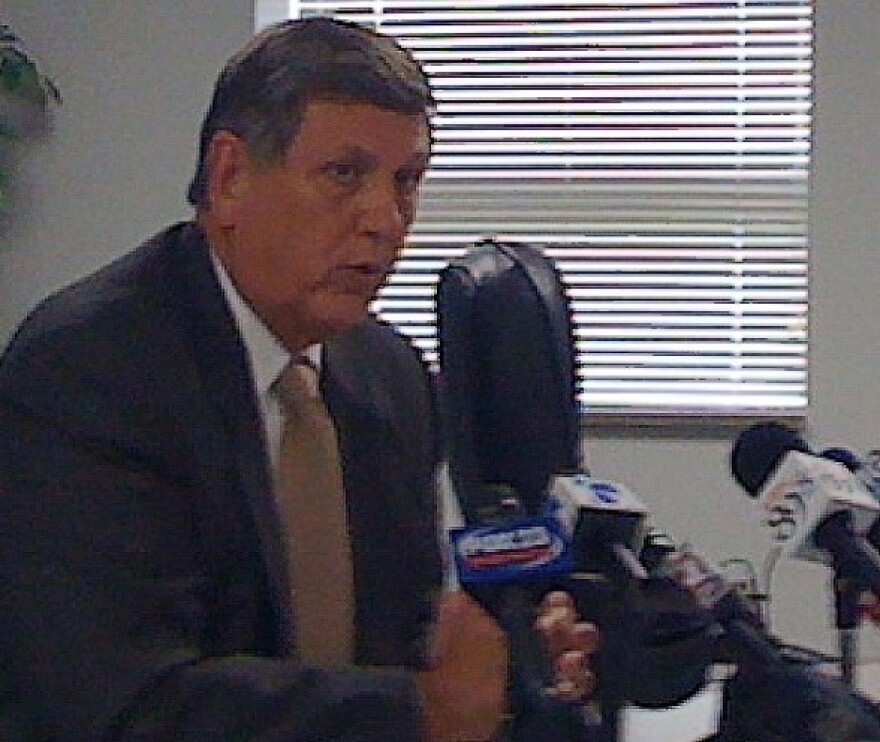 Dr. Keith Ballard talks with reporters.