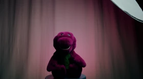 A vintage plush talking Barney is filmed in a Connecticut Public studio.