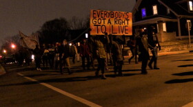People marched through the streets of Bloomington's neighborhoods chanting and singing.