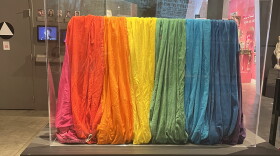 A portion of the original rainbow flag on display at the GLBT museum, which has eight stripes and is made of cotton muslin.