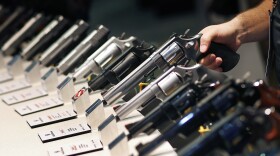 In this Jan. 19, 2016 file photo, handguns are displayed at the Smith & Wesson booth at the Shooting, Hunting and Outdoor Trade Show in Las Vegas. (John Locher, File/AP)