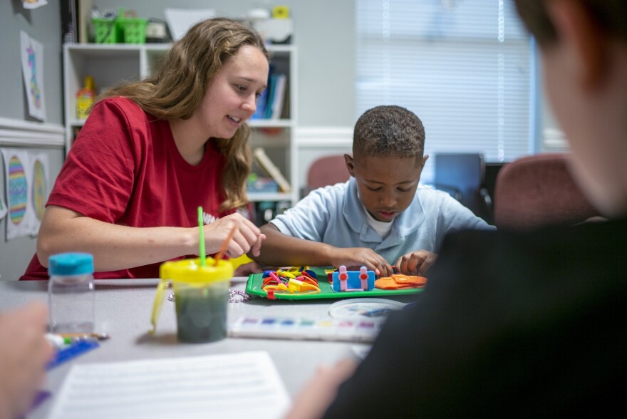 Therapist Rachel Luttrell works with IMPACT student Ricardo.