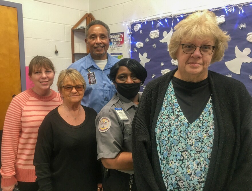 Charles Hall poses with prison staff, including his supervisor and counselors. Many of them signed letters supporting his request for clemency.