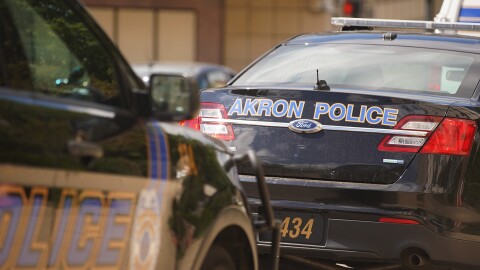 Akron Police Department cruisers are seen in Downtown Akron.