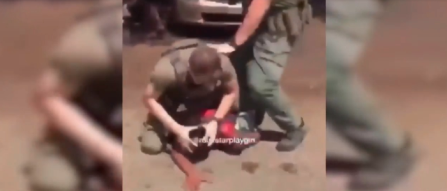 A screenshot of a cell phone video that circulated on social media showing a Broward Sheriff's Office deputy violently arresting then-15-year-old Delucca Rolle in April 2019.