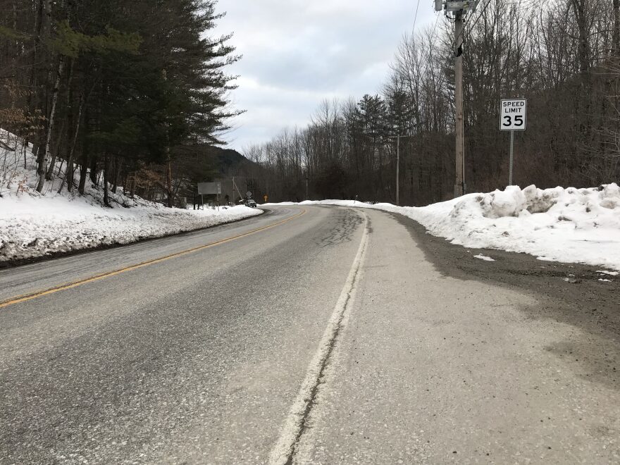 A stretch of road in Plymouth, Vermont, with a 35 miles per hour speed limit sign on the right and a car approaching in the distance.