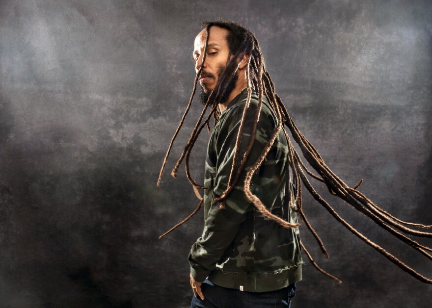 Ziggy Marley sings on stage.