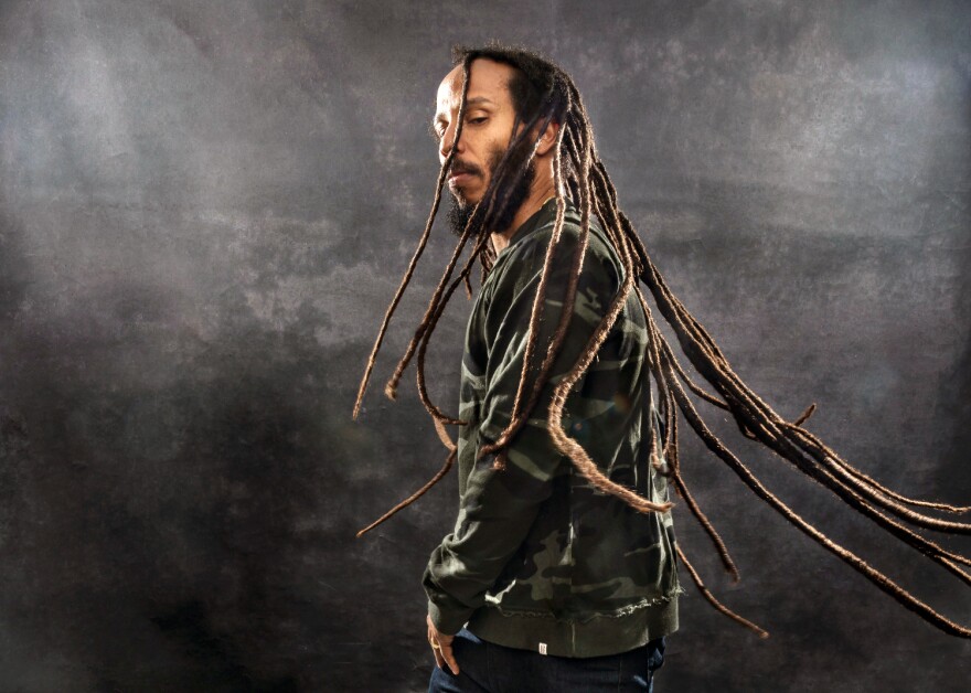 Ziggy Marley sings on stage.