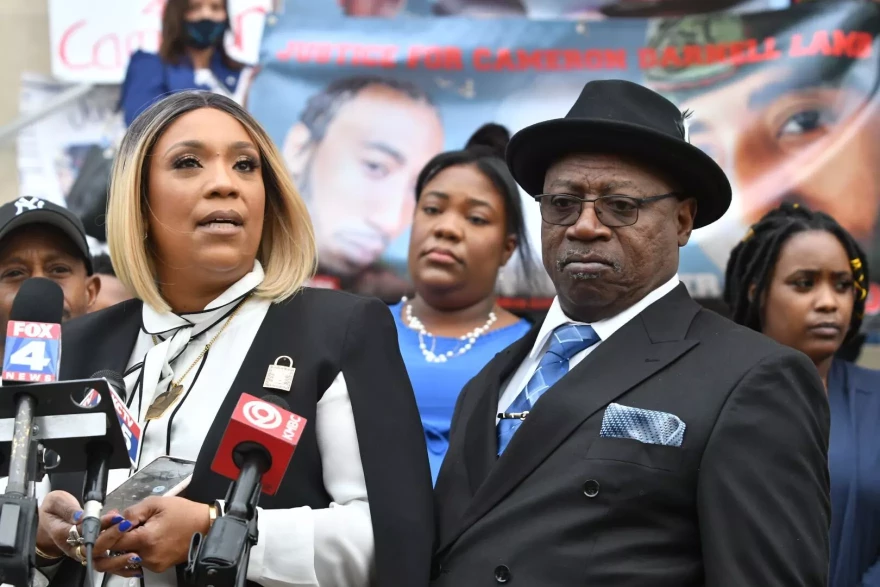 Cameron Lamb's mother, Laurie Bey, and her husband, Aqil Bey, speak outside the Jackson County Courthouse on March 4, 2022, following the sentencing of Kansas City police detective Eric DeValkenaere.