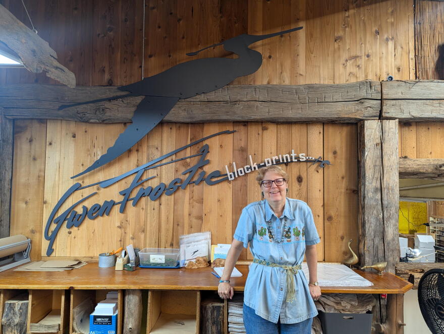 Sandra Grahl stands in the Benzie County studio of the late artist Gwen Frostic. (Photo: Natalie Reitz / Transom Story Workshop)