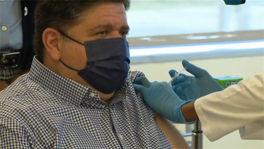  Gov. JB Pritzker receives his COVID-19 vaccine booster shot Tuesday in Chicago before heading to London on his first international trip as governor. 