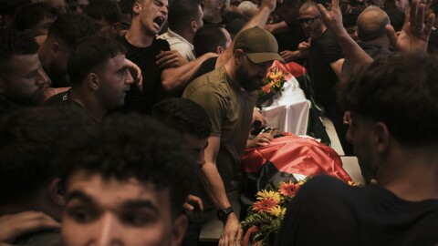 Mourners carry the bodies of Palestinian-American Sayfollah Musallet, 20, and Mohammed al-Shalabi during their funeral in the West Bank village of Al-Mazraa a-Sharqiya on Sunday, July 13, 2025. According to the Palestinian Health Ministry, Musallet was killed in an attack by Israeli settlers and al-Shalabi was shot in the chest.