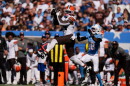 Cleveland Browns tight end Harold Fannin Jr. (44) makes a first down catch over Tennessee Titans cornerback Cor'dale Flott (18) during the first half of an NFL football game in Nashville, Tenn., Sunday, Oct. 25, 2026.  