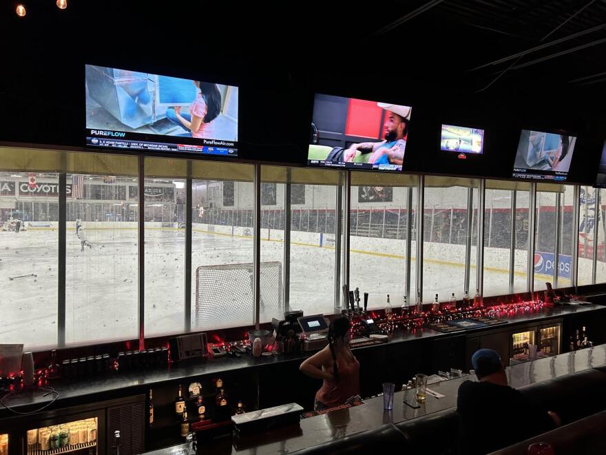 Window to the ice rink from Ice House Tavern