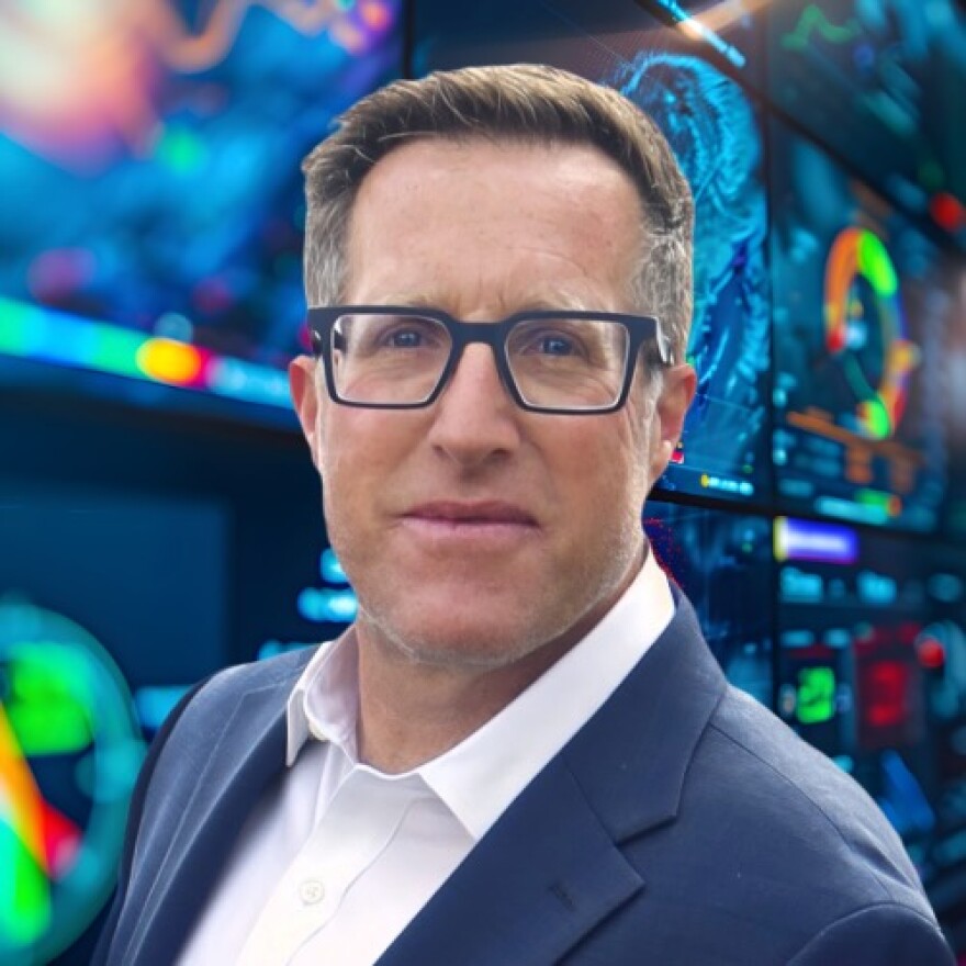 Man in front of weather graphics