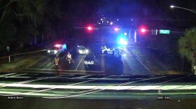 Emergency personnel work after the fatal crash on Friday night.
