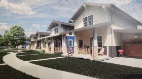 An artist rendering of houses to be built as part of the Broadway Cottage Courtyard in Springfield, Mo. displayed at the Fairbanks on February 26, 2026.