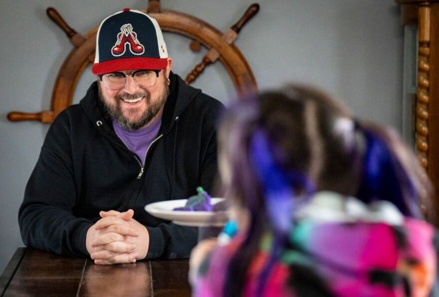 Justin Beattey talks with his daughter Josslynn, 8, after school on Jan. 9, 2026, at their home in Indianapolis. 