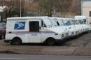 USPS mail trucks parked in a row