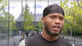 A football player talks to the camera