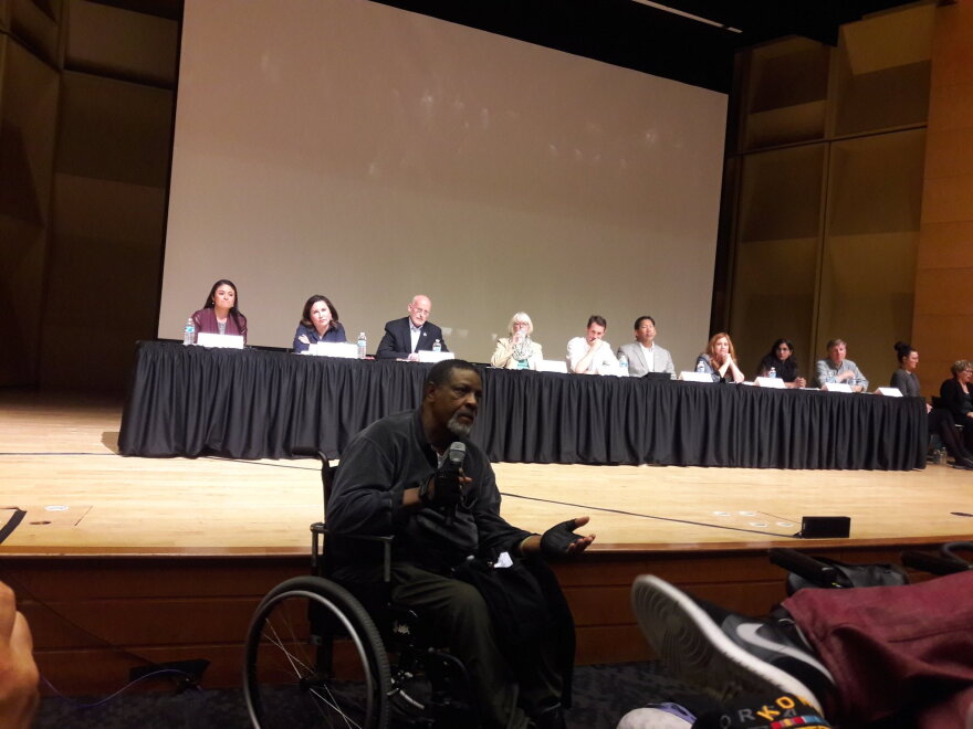 Charleena Lyles' father, Charles, speaks to the crowd at the UW's Kane Hall as City Council members watch on Tuesday, June 27. 'She died on Father's Day. Every Father's Day I'll think of that,' he said.