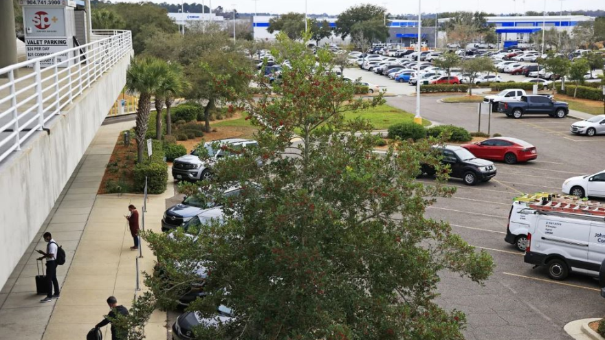 Travelers come and go at Jacksonville International Airport parking lots in early 2022.