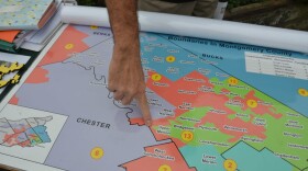 Fair Districts PA organizer Rich Rafferty points to a spot in the old PA-07 in Montgomery County. The district was just as wide as a restaurant parking lot at that point on the map. The old PA-07 was considered a poster child for gerrymandering. (Alex Schroeder/On Point)