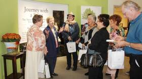 Sister Nancy Nolan begins a tour for a group of people Saturday during the grand opening of the new permanent shrine for Saint Mother Theodore Guerin.