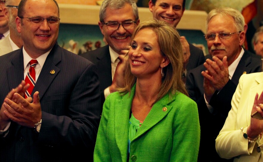 Rep. Shelley Keeney, R-Marble Hill, basks in applause of her colleagues on Friday. Keeney accepted a marriage proposal while presiding over the Missouri House.