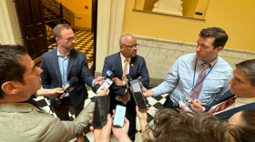 Delegate Luke Torian speaks to reporters after announcing a compromise budget.