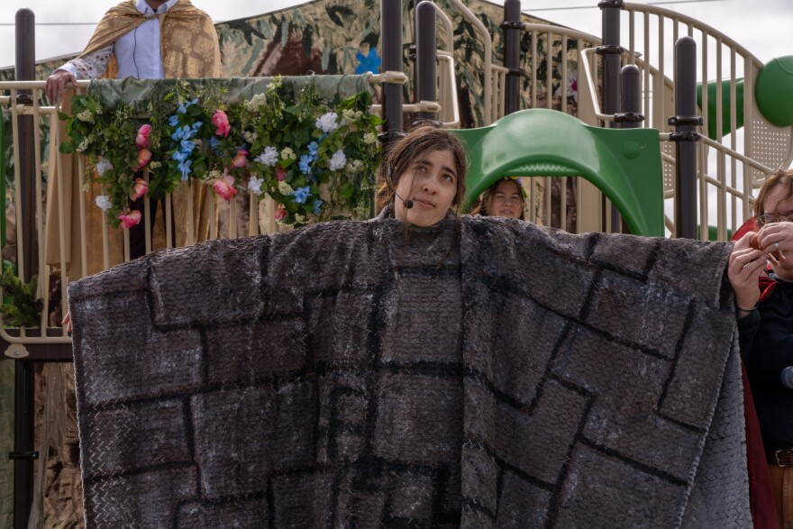 Ryan Cotter plays the part of Wall in a play within the play of "A Midsummer Night's Dream." May 24, 2025.