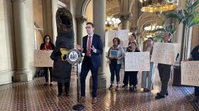 Rob Hayes addressing a row of reporters, urging Governor Kathy Hochul to include funding for lead pipe replacement in her next budget