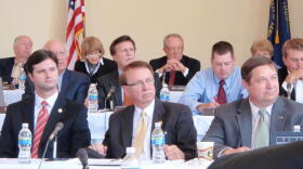 Some committee members view a video about Princeton before the meeting begins.