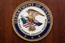 The seal of the Dept of Justice is shown on the podium, Aug. 1, 2023, at an office of the Department of Justice in Washington.
