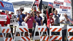 Protesters gather outside of the Broward County Supervisor of Elections office during a recount on Sunday, Nov. 11, 2018, in Lauderhill, Fla. 