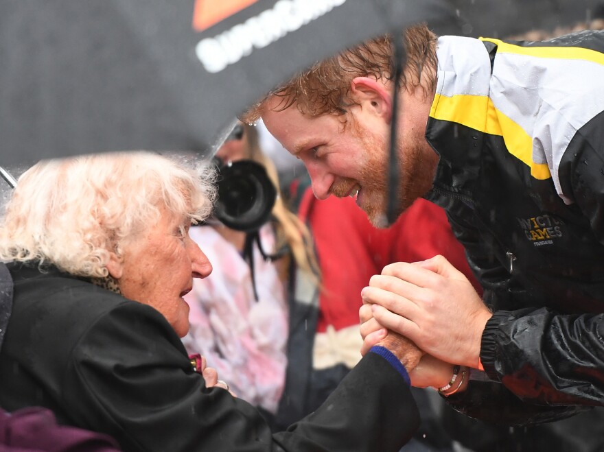 Britain's Prince Harry meets with Daphne Dunne in Sydney in 2017.