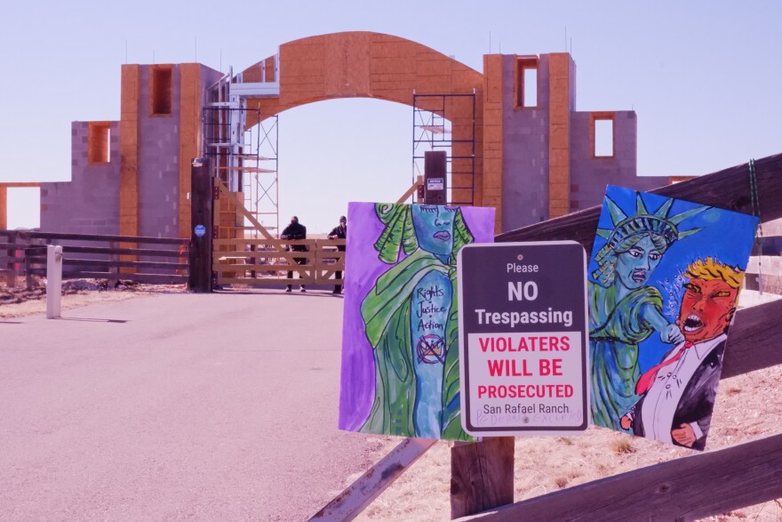 Masked security guards were seen just inside the gates of Zorro Ranch