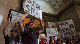 Josiah Zimmer, 29, of St. Louis' Tower Grove East neighborhood, joins thousands in protesting the Missouri legislature's efforts to redraw congressional maps in favor of Republicans and change the initiative petition process on Wednesday, Sept. 10, 2025, at the state Capitol in Jefferson City.
