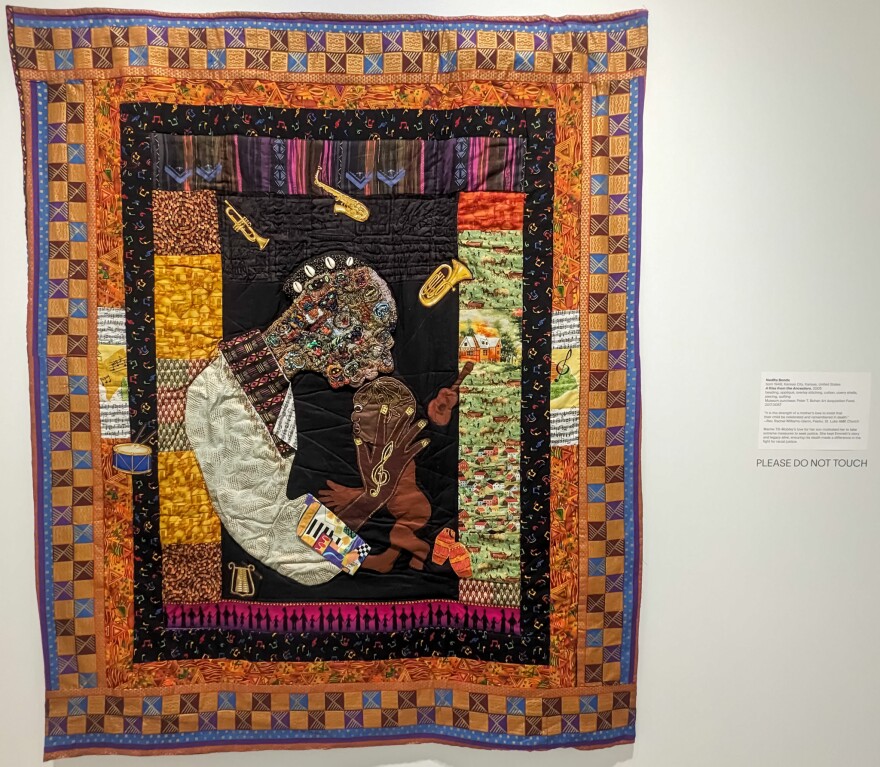 Kansas City, Kansas artist Nedra Bonds quilt named "A Kiss From The Ancestors" on display as part of the "One History, Two Versions" exhibit at the Spencer Museum of Art at the University of Kansas, Lawrence campus. It depicts the bond between Black mother and child that is central to the story of Mamie Till-Mobley and her never ending dedication to keeping the memory and story behind the senseless slaying of her son, Emmett Till.