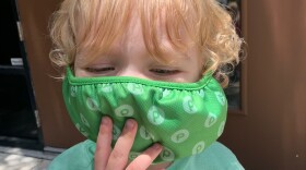 Carter Wolfe poses for his mom as he practices wearing a mask. For some people with autism, sensory processing issues can make precautions like wearing a mask more difficult. (Photo courtesy of Marcia Wolfe)