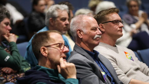 DeeJay Johannessen, CEO of the HELP Center for LGBTQ+ Health, center, sits in a City Council meeting Feb. 10, 2026, in Arlington. Johannessen told the council the resolution would’ve been a great statement of what the city is had it not come right after “stripping Arlington citizens of their basic civil rights.”